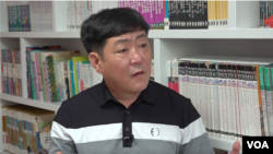 Hong Gang-chul, a former North Korean border guard who now lives in South Korea, speaks with VOA during an interview at his home office in July 2021. According to Hong, it has become much more difficult to send money to North Korea. (VOA) 