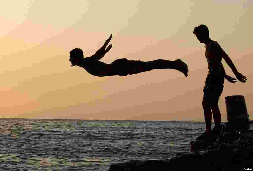 A man dives into the sea in Beirut, Lebanon.