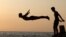 A man dives into the sea in Beirut, Lebanon.