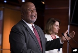 Rep. Bennie Thompson, D-Miss., the ranking member of the House Homeland Security Committee, joins House Minority Leader Nancy Pelosi, D-Calif., right, at a news conference, June 29, 2017.