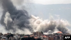 CORRECTION / Smoke billows during Israeli bombardment on the village of Khiam in south Lebanon near the border with Israel on June 19, 2024 amid ongoing cross-border tensions as fighting continues between Israel and Hamas in the Gaza Strip.