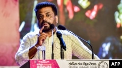 Sri Lanka's President and National People's Power (NPP) party leader Anura Kumara Dissanayake addresses supporters during a rally ahead of upcoming parliamentary elections, in Colombo, Nov. 11, 2024.