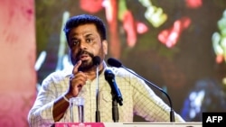 FILE - Sri Lanka's President and National People's Power (NPP) party leader Anura Kumara Dissanayake addresses supporters during a rally in Colombo, Nov. 11, 2024.