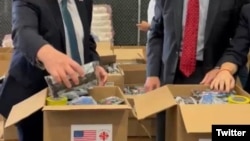 Mike Hammer and Jeremy Lewin packing up aid for Cuban victims of hurricane Melissa.