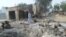 A man walks past burnt out houses following an attack by Boko Haram in Dalori village 5 kilometers (3 miles) from Maiduguri, Nigeria, Jan. 31, 2016.