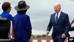 FILE - President Joe Biden greets Los Angeles Mayor Karen Bass, left, and Rep. Maxine Waters, D-Calif., as he arrives at Los Angeles International Airport, February 20, 2024, in Los Angeles.