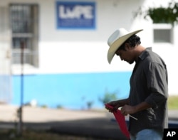 Michael Mireles of La Unión del Pueblo Entero (LUPE) listens as the group holds a news conference to talk about the previous day's election in San Juan, Texas, Nov. 6, 2024.