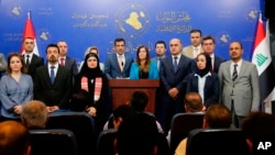 Iraqi Kurdish lawmakers, members of Kurdistan Democratic Party Parliamentary block speaks to journalists during a press conference in Baghdad, Iraq, Oct. 2, 2018.