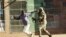 FILE: A Zimbabwean soldier beats a man in a street of Harare on August 1, 2018 as protests erupted over alleged fraud in the country's election.