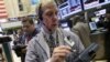 Trader Richard Cohen, right, works on the floor of the New York Stock Exchange, September 7, 2012.