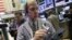 Trader Richard Cohen, right, works on the floor of the New York Stock Exchange, September 7, 2012.