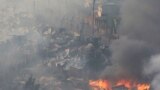 آتش سوزی جنگلی&zwnj; در شهر والپارایسو در کشور شیلی. با این که بیش از ۱۰۰ خانه در این آتش سوختند، هیچ کس جان خود را از دست نداد.