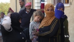 Syrian refugees flee Lebanon, head back to Syria