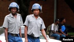 Zimbabwean police patrol the streets of the capital Harare, March 1, 2011. 