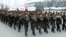 North Korean students attend a contest of singing wartime songs in chorus while marching in array, at Kim Il Sung square in Pyongyang in this picture released by the North's KCNA news agency March 17, 2013.