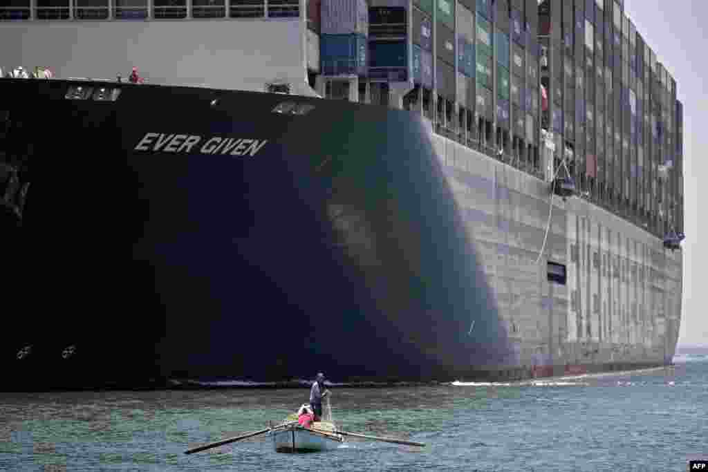 A view of the Panama-flagged MV &#39;Ever Given&#39; container ship sailing along Egypt&#39;s Suez Canal near the canal&#39;s central city of Ismailia.