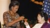 First lady Michelle Obama, left, toasts former Indonesian President Megawati Sukarnoputri, during a state dinner at the Istana Negara in Jakarta, Indonesia, Tuesday, Nov. 9, 2010. (AP Photo/Charles Dharapak)