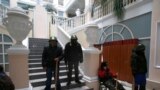 Protesters stand guard inside the Justice Ministry in central Kyiv, Jan. 27, 2014.