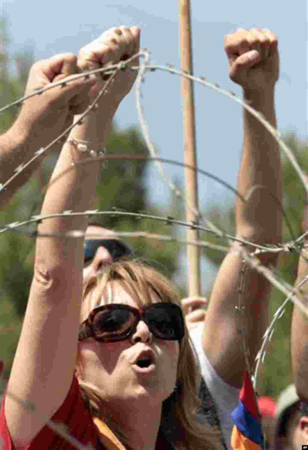 A Lebanese Armenian protester shouts anti-Turkey slogans during a protest to mark the 97th anniversary of massacres in Turkey that began in April 1915 and in which hundreds of thousands of Armenians died, in front of the Turkish embassy, in Rabiyeh north 