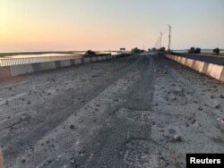 A view shows the damaged Chonhar bridge connecting Russian-held parts of Ukraine's Kherson region to the Crimean peninsula