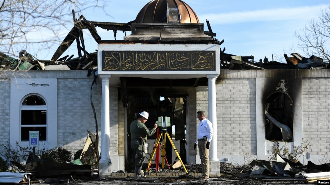Security officials investigate the aftermath of a fire at the Victoria Islamic Center mosque in Victoria, Texas, Jan. 29, 2017. 