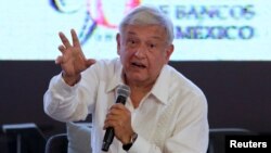 FILE - Leftist front-runner Andres Manuel Lopez Obrador, presidential candidate of the National Regeneration Movement (MORENA), addresses the audience during the Mexican Banking Association's annual convention in Acapulco, Mexico, March 9, 2018. 
