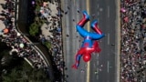 A Spiderman balloon passes through a street during a Christmas festival in Santiago, Chile, Dec. 1, 2024. 