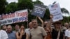 White South Africans demonstrate in support of US President Donald Trump in front of the US Embassy in Pretoria, South Africa, Feb. 15, 2025.