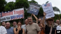 White South Africans demonstrate in support of US President Donald Trump in front of the US Embassy in Pretoria, South Africa, Feb. 15, 2025.