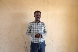 Surgeon and doctor-turned-refugee, Tewodros Tefera, stands for a photograph in the Hamdayat Transition Center near the Sudan-Ethiopia border, eastern Sudan, Dec. 15, 2020.
