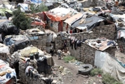 FILE - Boys play at a slum area for the Muhamasheen (marginalized) community in Sana'a, Yemen, July 26, 2020.