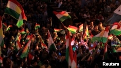 Kurds celebrate in support of the independence referendum in Duhok, Iraq, Sept. 26, 2017. 