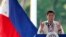 Philippine President Rodrigo Duterte gestures while speaking following a wreath-laying ceremony in observance of National Heroes Day, Aug. 29, 2016 at the Heroes Cemetery in suburban Taguig city, east of Manila.