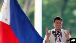 FILE - Philippine President Rodrigo Duterte gestures while speaking.