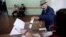 An elderly Bulgarian casts his ballot for parliamentary elections in Sofia, May 12, 2013.