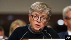 FILE - In this June 5, 2018, photo, former Michigan State President Lou Anna Simon testifies before a Senate subcommittee in Washington. Simon has been charged with lying to police conducting an investigation of Larry Nassar's sexual abuse. 