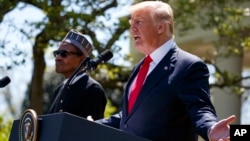 President Donald Trump gestures during a news conference with President Muhammadu Buhari in the Rose Garden of the White House, April 30, 2018, in Washington. 