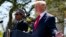 President Donald Trump gestures during a news conference with President Muhammadu Buhari in the Rose Garden of the White House, April 30, 2018, in Washington. 
