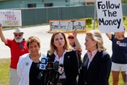 Rep. Debbie Mucarsel-Powell, D-Fla., center, speaks to members of the media about her tour of the Homestead Temporary Shelter for Unaccompanied Children, as Rep. Donna Shalala, D-Fla., left, and Rep. Sylvia Garcia, D-Texas, right, Feb. 19, 2019.