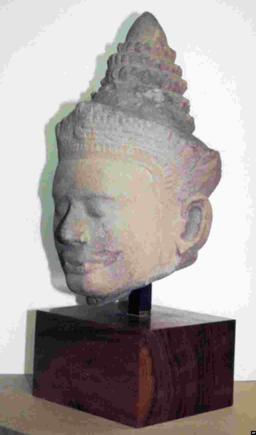 12th century head of an Asura (demon) from Angkor, Cambodia.