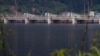 FILE - A dam is seen on the Nam Theun river in central Laos, Oct. 24, 2010. Despite opposition, plans are underway for the construction of a new dam across the Mekong river.