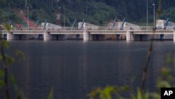 FILE - A dam is seen on the Nam Theun river in central Laos, Oct. 24, 2010. Despite opposition, plans are underway for the construction of a new dam across the Mekong river.