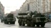 FILE - Russian S-300 anti-missile rocket systems move along a central street in Moscow, May 4, 2009.