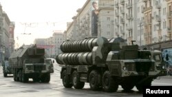 FILE - Russian S-300 anti-missile rocket systems move along a central street in Moscow, May 4, 2009.