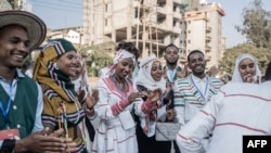 FILE - Couples dressed in a traditional attire dance during a mass wedding called ‘Yeshih Gabicha’ in Addis Ababa, Ethiopia on January 14, 2024.