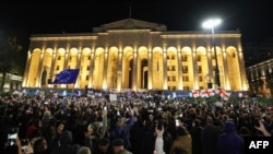 Georgian opposition supporters rally to protest results of the parliamentary elections that showed a win for the ruling Georgian Dream party, outside the parliament building in central Tbilisi, Oct. 28, 2024. 