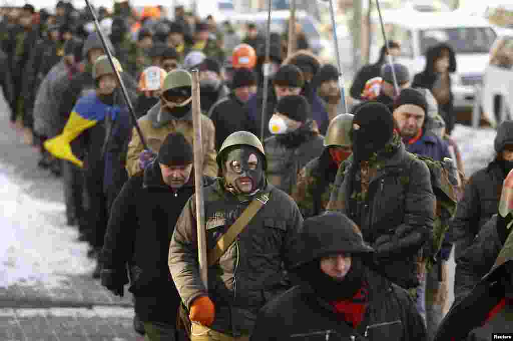 Anti-government protesters march in central Kyiv, Jan. 31, 2014.