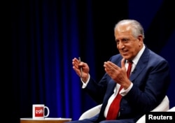 FILE - U.S. envoy for peace in Afghanistan Zalmay Khalilzad speaks during a debate at Tolo TV channel in Kabul, Afghanistan, April 28, 2019.