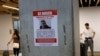 A wanted poster of Venezuela's opposition leader Edmundo Gonzalez covers a column at the Simon Bolivar International Airport in Maiquetia, near Caracas, Venezuela, Jan. 3, 2025. 