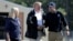 President Donald Trump shakes hands with FEMA Administrator Brock Long as Homeland Security Secretary Kirstjen Nielsen watches after visiting areas in North Carolina and South Carolina impacted by Hurricane Florence, Sept. 19, 2018, at Myrtle Beach International Airport in Myrtle Beach, S.C.
